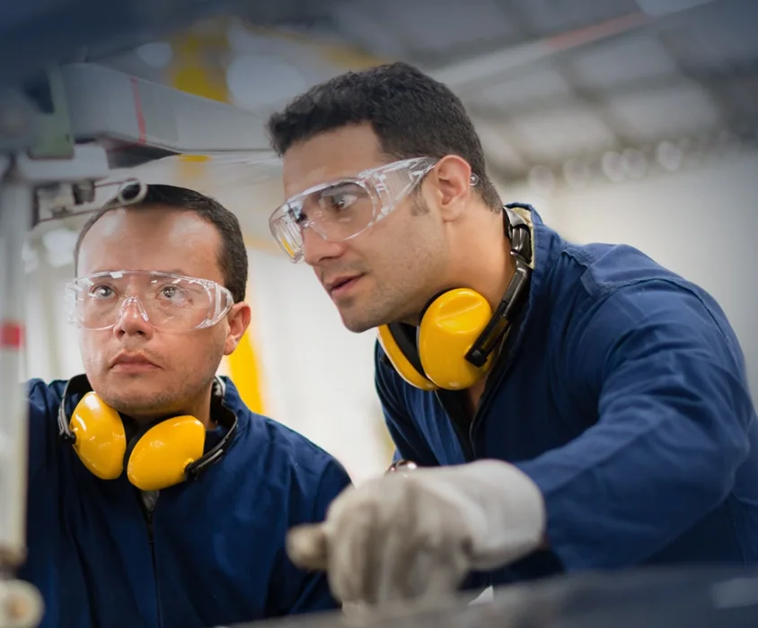 Canan Testing engineers at work on a testing machine